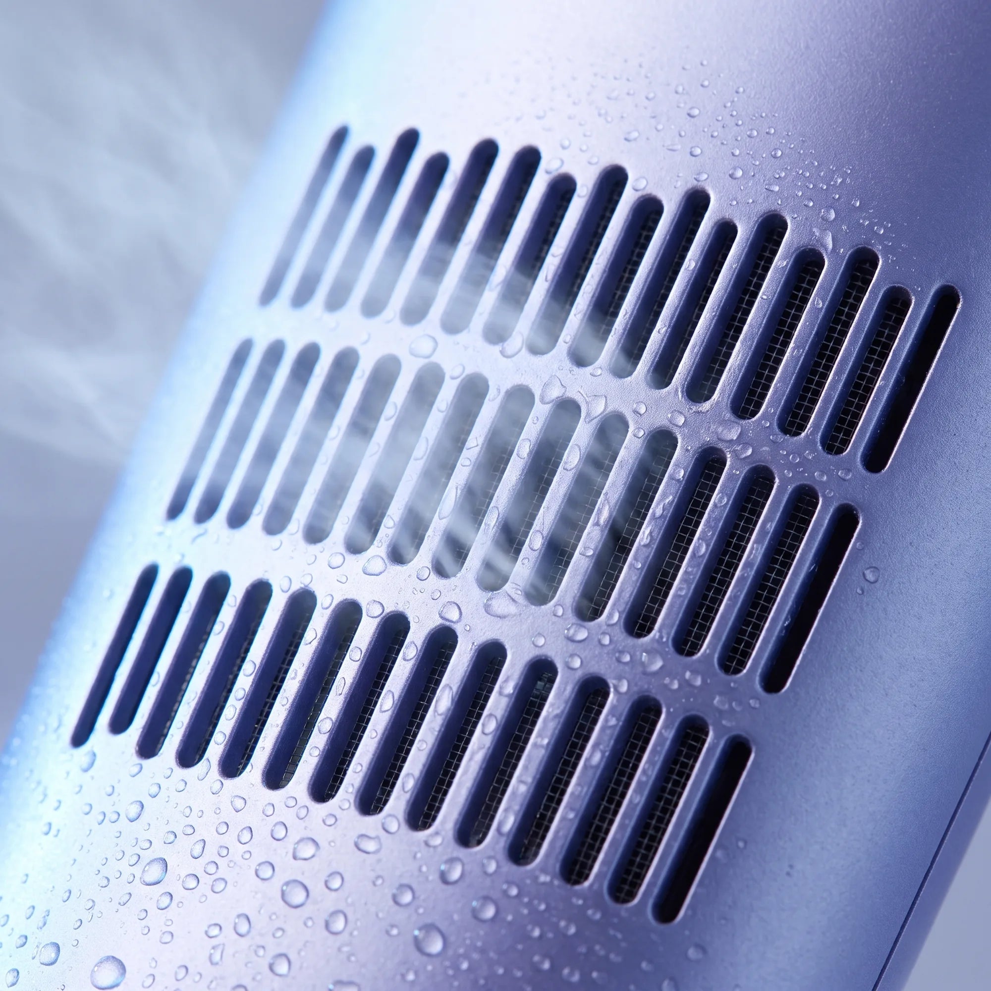Macro close-up of Zephra's cold-air vent with visible mist and condensation on the matte purple casing